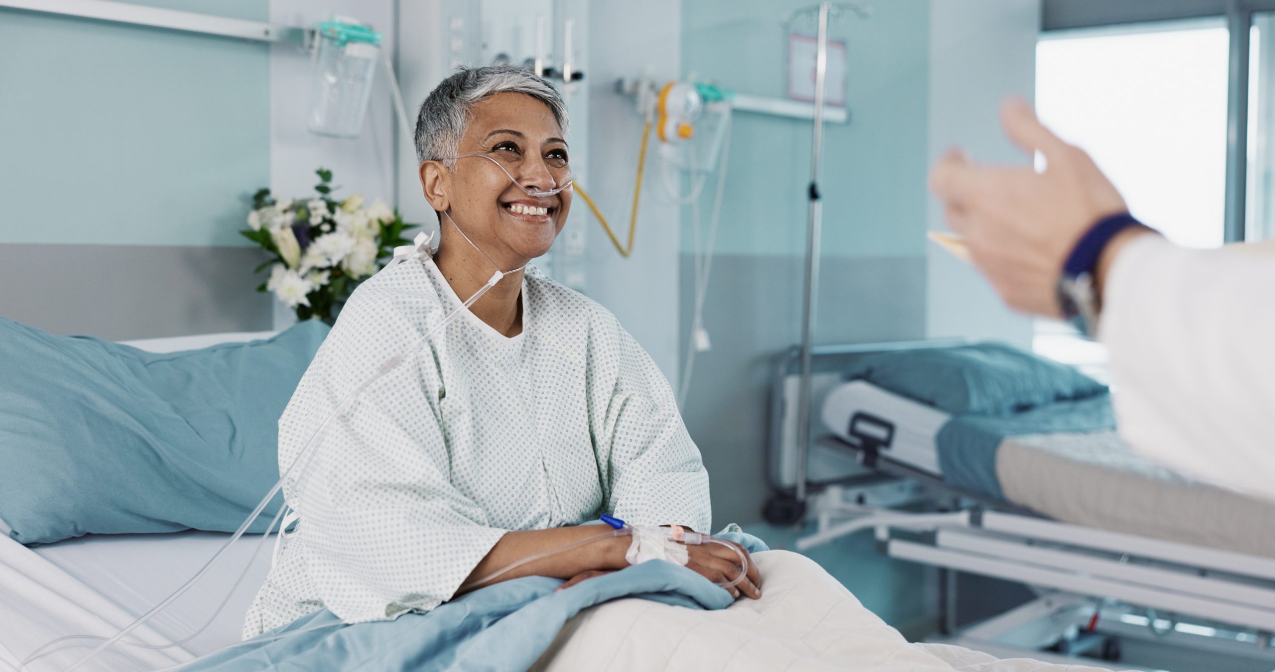 Doctor sharing positive recovery news with a patient