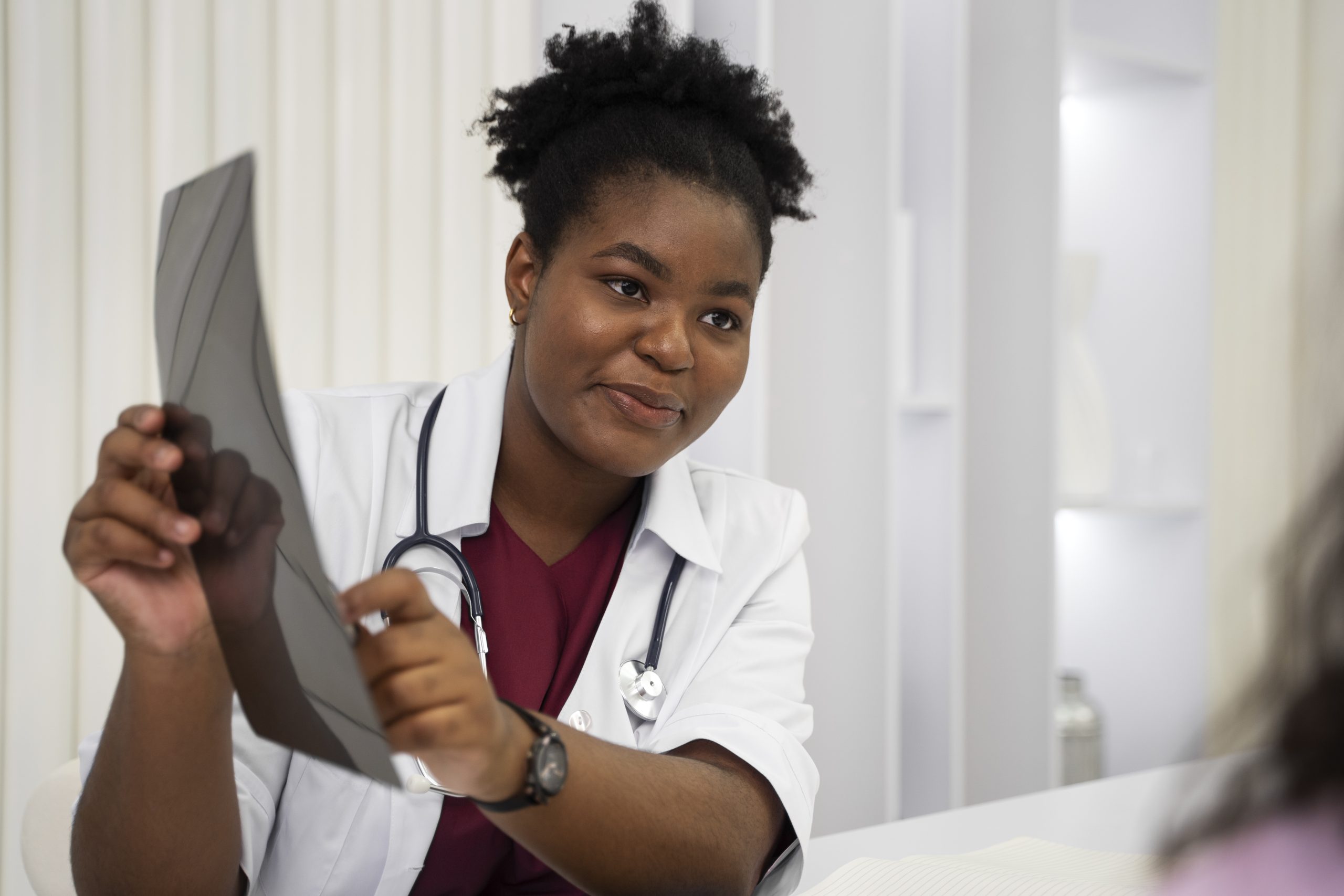 Healthcare professional examining radiography