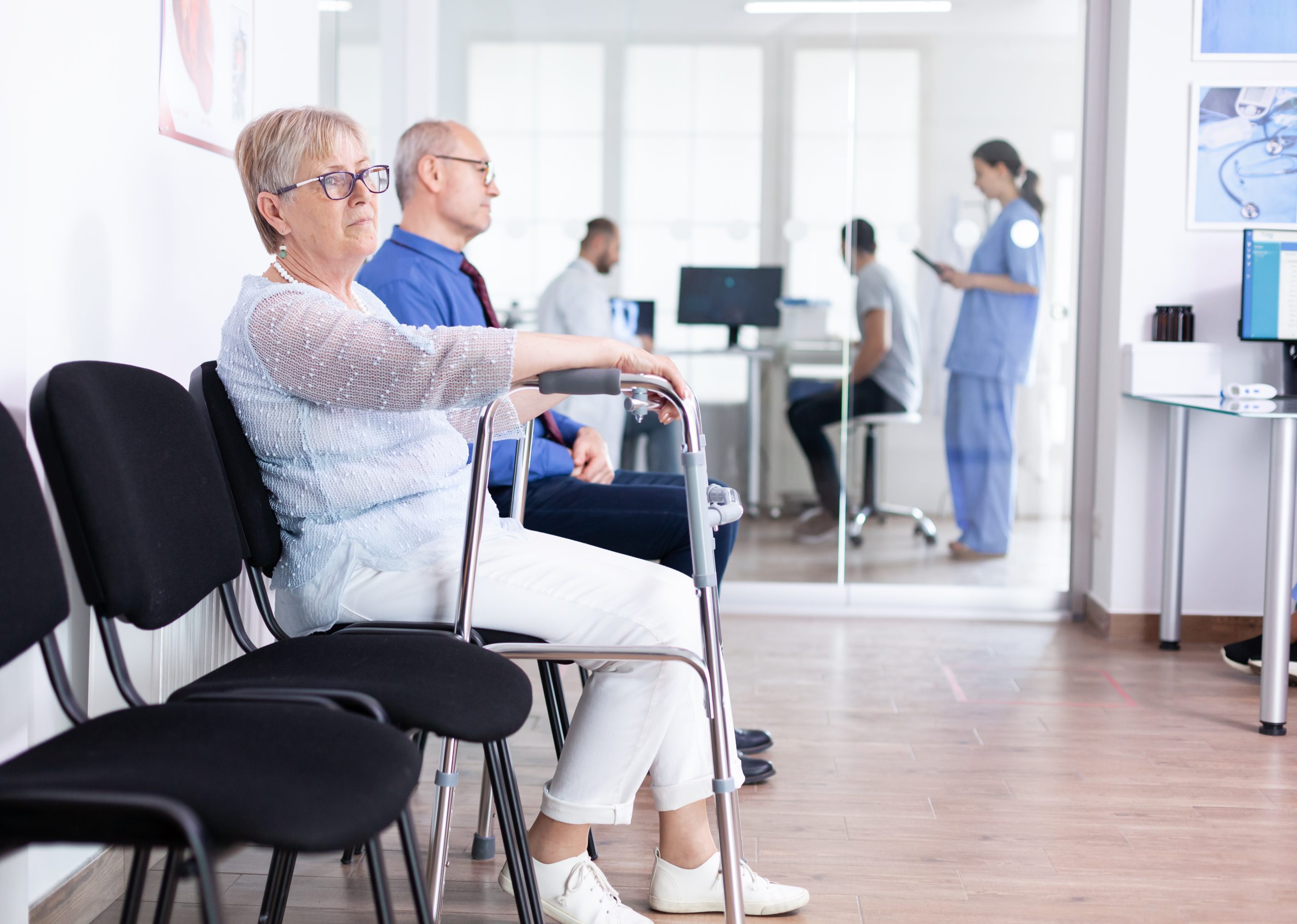 Senior patient using a walking frame during recovery